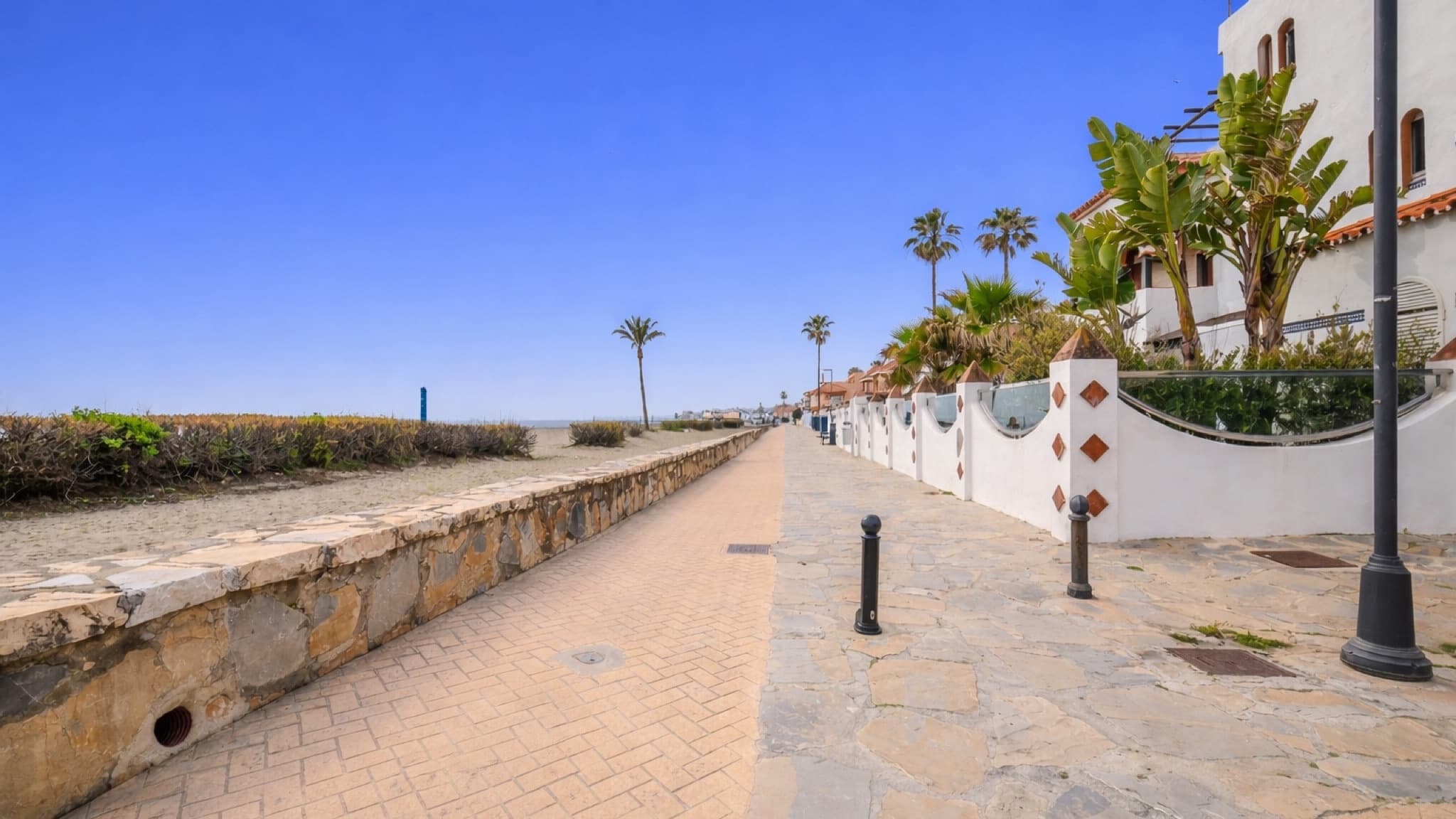 Seafront promenade and homes in Casares Costa.