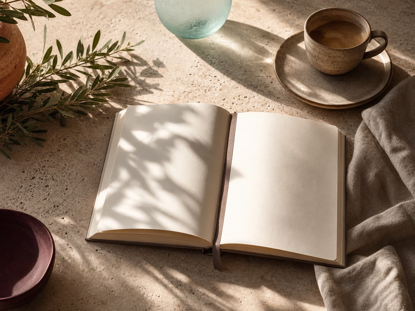 Generated editorial still life with a blank journal, coffee and Mediterranean textures.